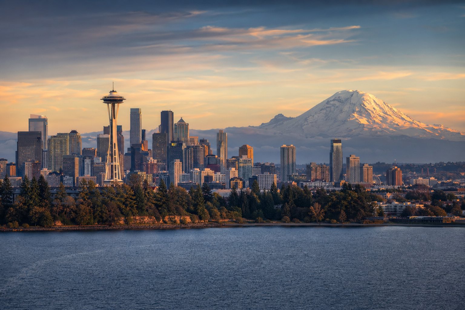 Modern photograph of the Seattle skyline with Mount Rainier at golden hour representing Credo Enterprise' Washington service area